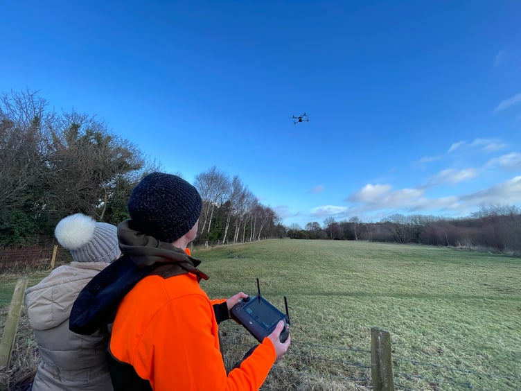 Ben Harrower controlling the drone with a thermal imaging camera attached in the Curraghs