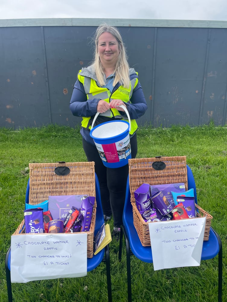 Rebecca Warren from Ernest Jackson Ltd with one of the Hospiscare charity collection buckets. AQ 8753