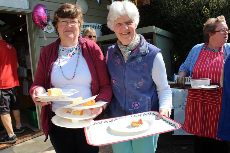 Jenny Berg who made the cake and (left) Julie Chapple who iced it and is assistant shop manager. SR 7772