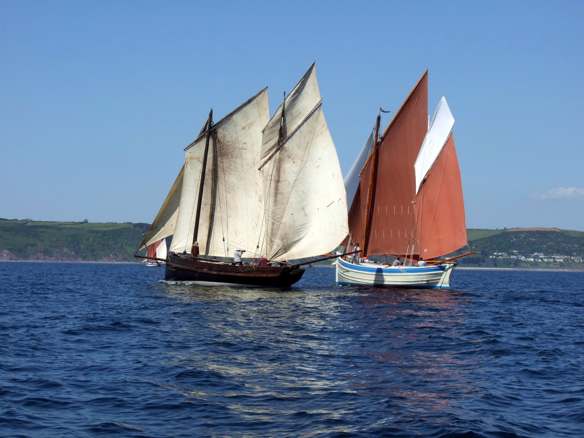 OUT IN FRONT: Jon and Judy Brickhill’s former fishing lugger Guide Me, which was built on the quayside at Looe in 1911, makes her way to the front of the fleet ahead of Nick Gates’ Ocean Pearl.