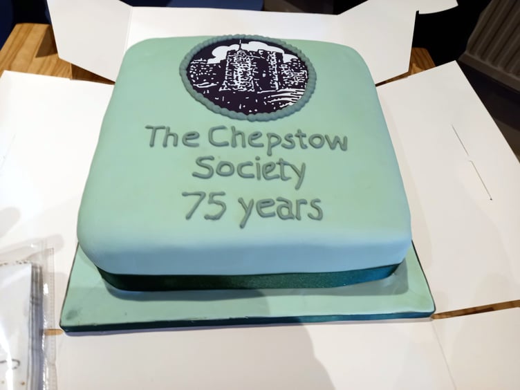 n Chepstow Society President Keith James, Chair Guy Hamilton, Treasurer David Nicholls and Secretary Sallie James with a cake celebrating 75 years of the Chepstow Society.