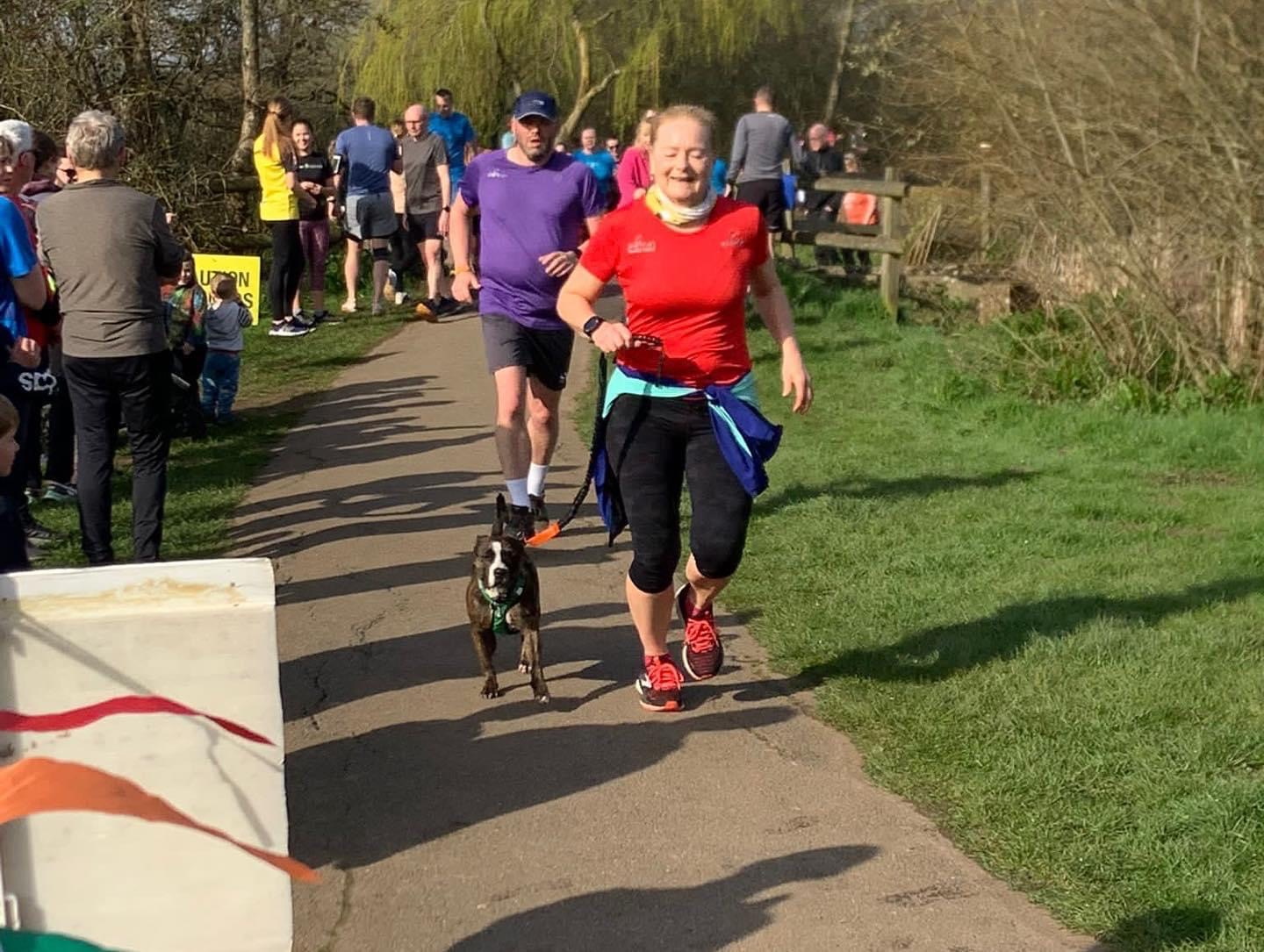 Karen Sinclair and Maisie near the finish line at Moors Valley parkrun