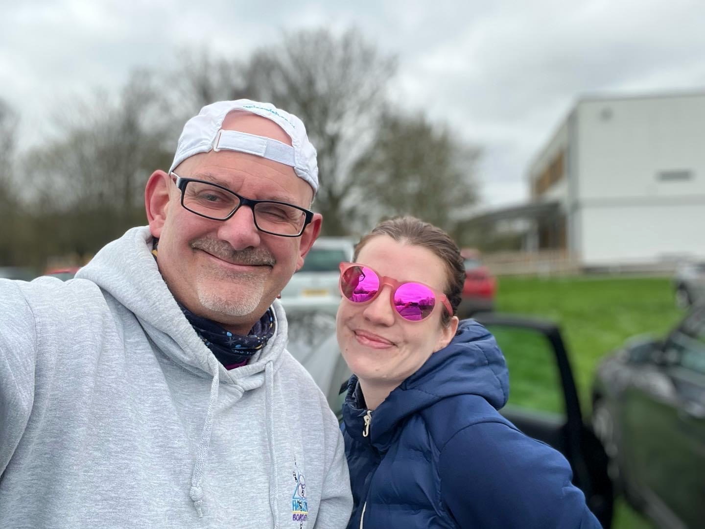 Steve King and Hesta Gilham keep warm before the Combe Gibbet to Overton trail run