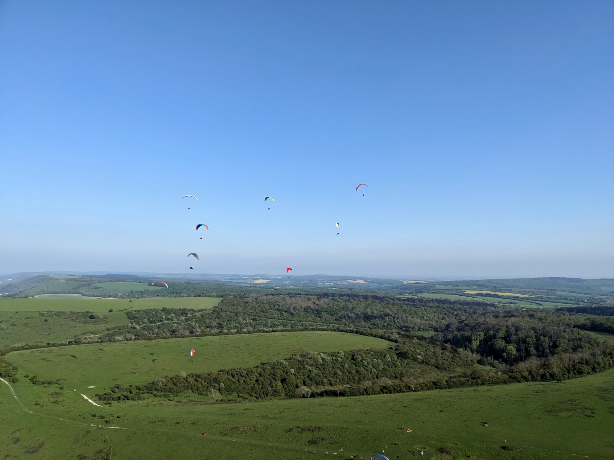 Paragliders enjoy the sunshine above Harting Down PHOTO BY ALAN BIRTLES