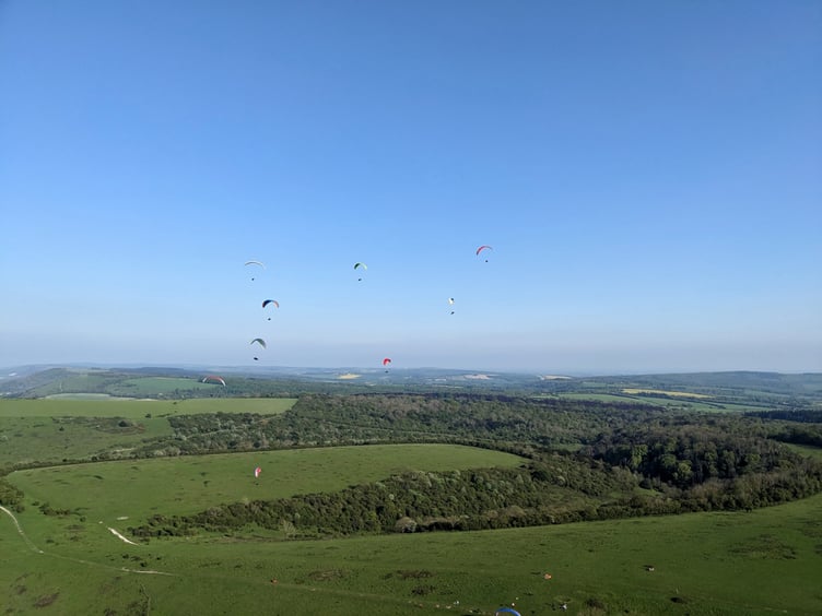 Paragliders enjoy the sunshine above Harting Down PHOTO BY ALAN BIRTLES