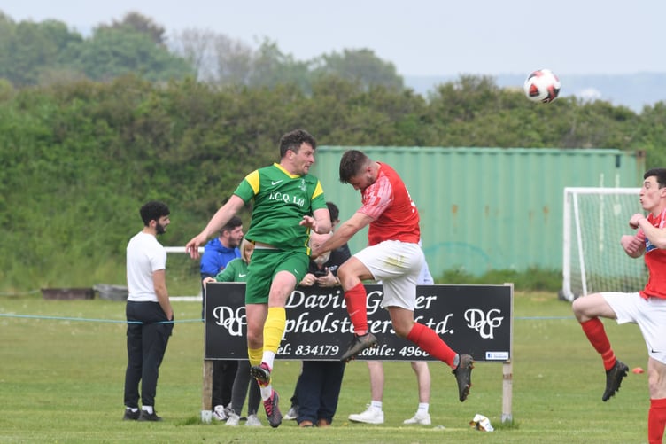 St Marys’ Frank Jones (left) leaps high to win a header against a Castletown opponent at the Stadium. The Saints proved too strong for the Mets and will now face Braddan in this weekend’s final (DK230520 (89))