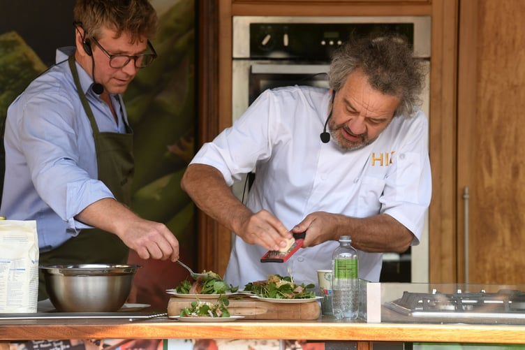 Celebrity Chef Mark Hix prepares food in a cookery demonstration assisted by The Watercress Company MD Tom Amery