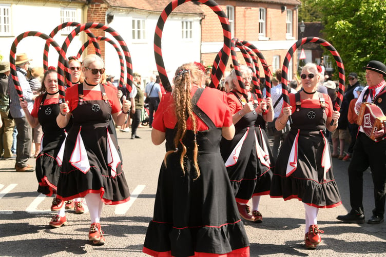 A women's Morris team enjoy the Alresford Watercress Festival Cavalcade