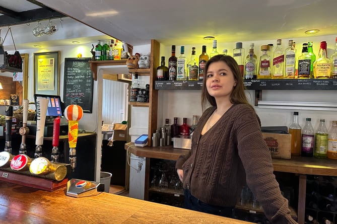 Maryna Haievska as a bar assistant at the Queens Head pub in Sheet