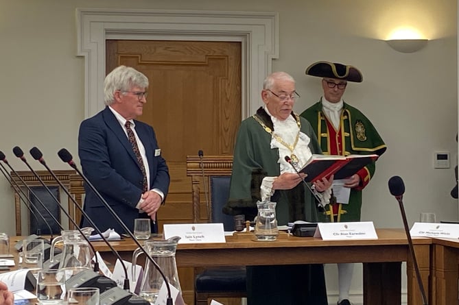 The Mayor of Farnham, Alan Earwaker, reads the official declaration to mark the beginning of his historic third term as the town's civic leader