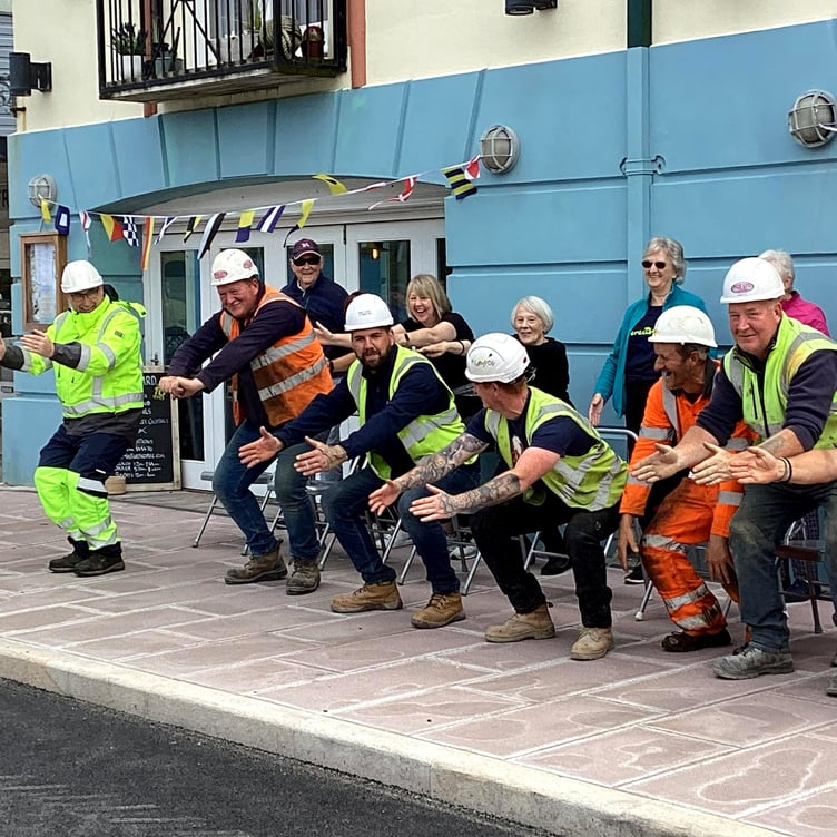 A pilates class involving contractors on Peel Quay