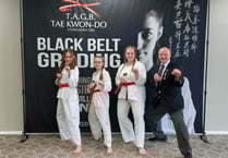 Time to celebrate as three receive their black belts
