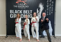 Time to celebrate as three receive their black belts