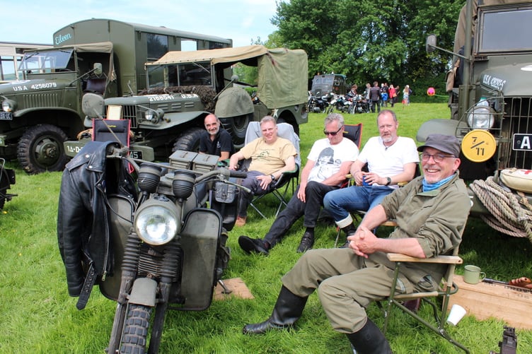 Surrounded by their vehicles, members of the 1st Division Silverton Irregulars. SR 7859