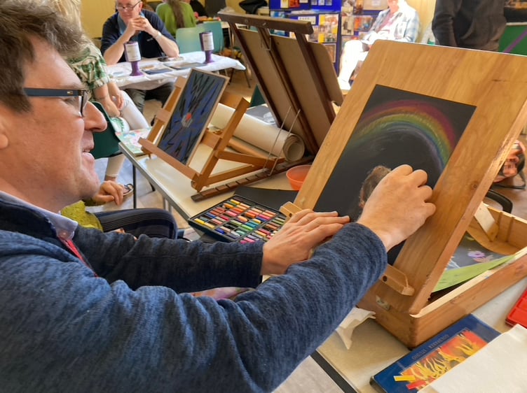 Health and Wellbeing Coach within the Social Prescribing team Simon Bloomfield enjoys the drawing area.