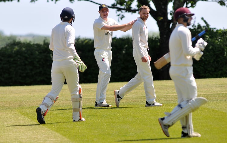 Devon Cricket League A Division. Abbotskerswell versus Kilmington. A smile from Abbots' Noah Tobias as Sam Cuconits is dismissed having been caught by Charlie Hill