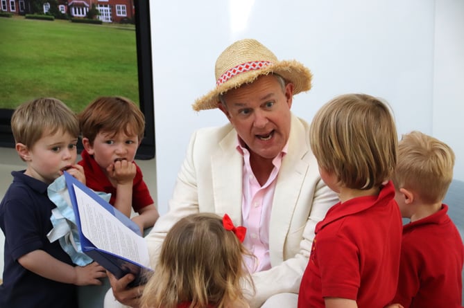 Hugh Bonneville, star of the Paddington films, reads an excerpt from Michael Bond’s tale to pupils at Highfield and Brookham Schools