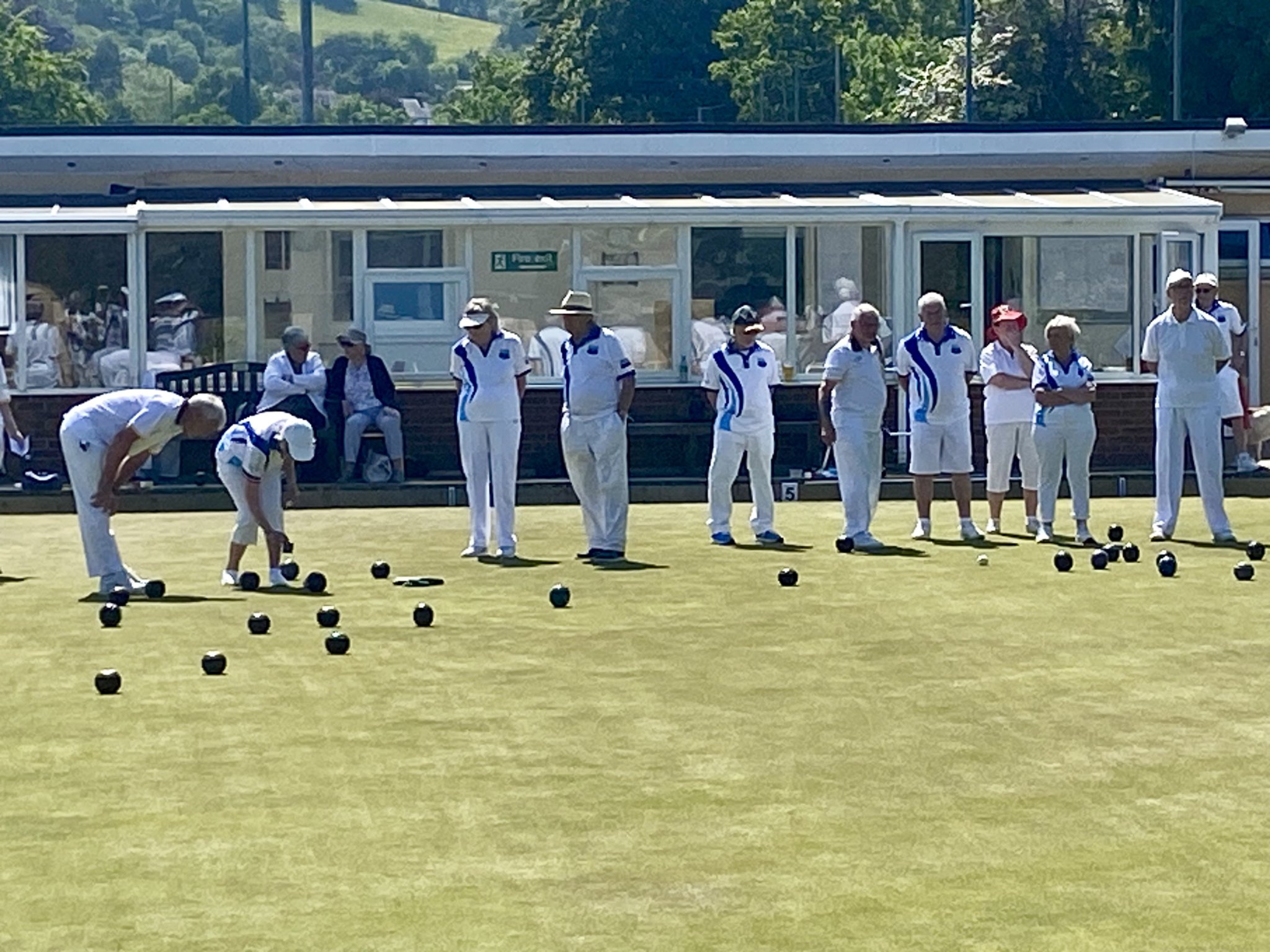CLOCKWISE FROM ABOVE: Action from the game against Troedyrhiw; Totnes’ busy bar; Captain Fred Martin wlecomes the tourers.