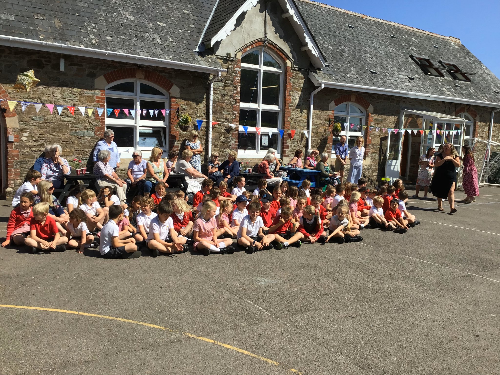 Pictures show the school children, Maypole dancing and, below, the Pre School and celebrating a ‘Good’ Oftsed report
