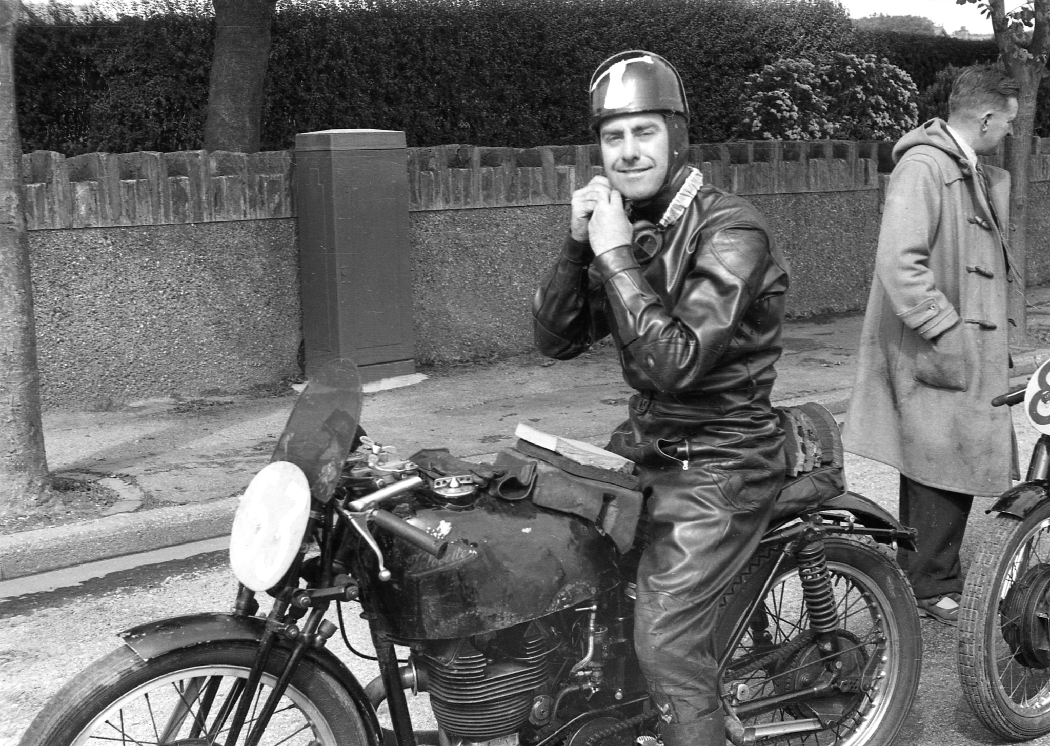 Tony Godfrey (Velocette) waits to start a practice lap for the 1956 Junior Manx Grand Prix, his Mk VIII looks well-worn>