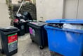 Resident dumps bin at town hall in protest