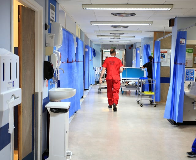 The Royal Surrey County Hospital staff took fewer sick days in December than a year before – as absences across England spike