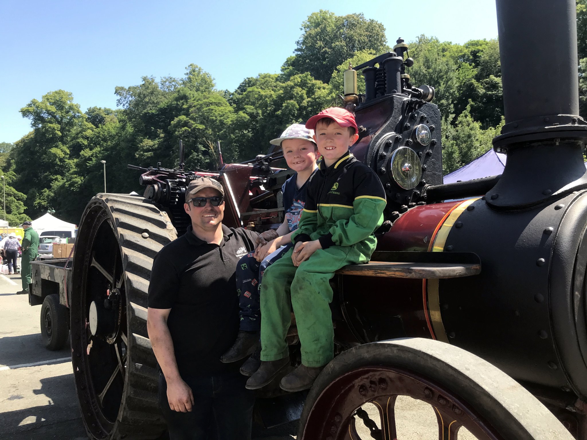 Tavistock Steam and Vintage Fair, Matt Young of Lamerton with sons Ruben, seven and Jack, eight, with their steam engine