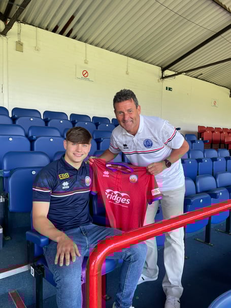 New Aldershot Town signing Josh Stokes with first-team manager Tommy Widdrington