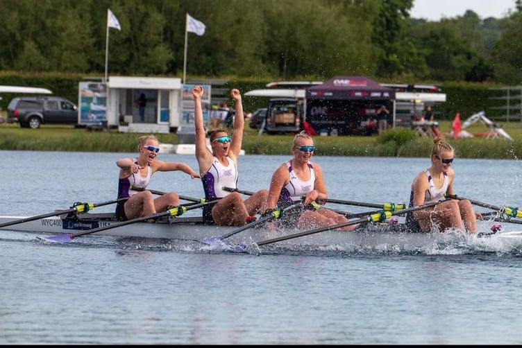 Yasmin Howe punches the air after her crew wins Championship girl quad sculls