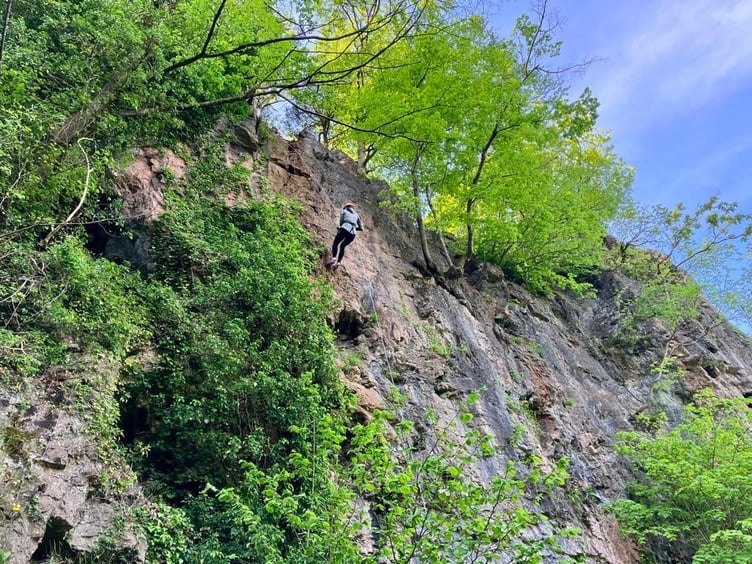 One of around 20 adventure-seekers Grace heads over the edge of the cliff