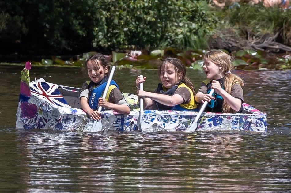 <p>Elstead girlguides Amelie, Nelina and Jenny on the water during the 2022 Elstead Paperboat Race</p>