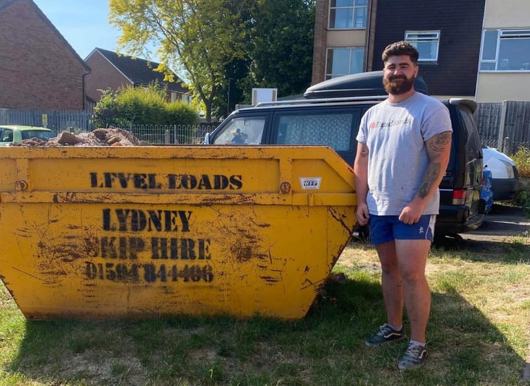 Thai Hayward beside the skip where the bomb was found