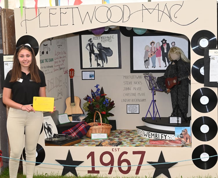 Louise Diamond Liskeard YFC secretary taking the third place award for the club in the YFC cubicle display with their entry entitled Fleetwood Mac