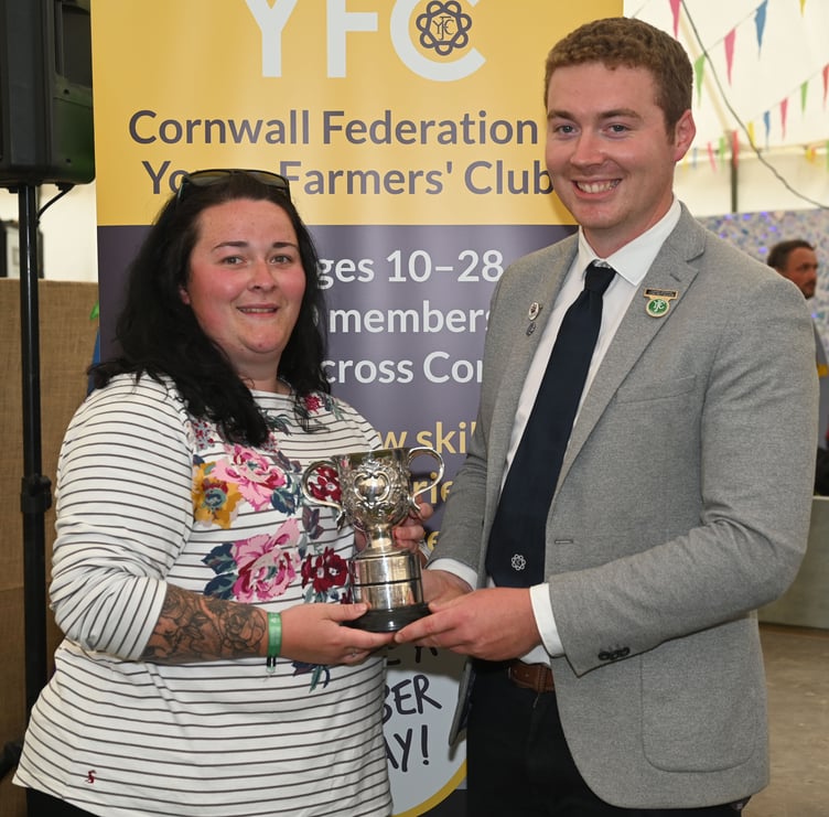 Kathryn Simms of Roche YFC receives the trophy for best cubicle display from Tom Retallack, chairman of Cornwall County YFC