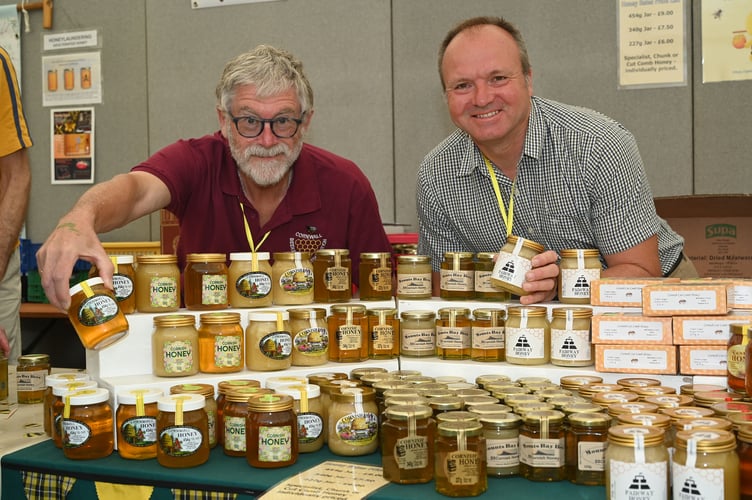 A warm welcome awaits with plenty of Honey to tempt you in the Bee Marquee pictured are Jeff Harper and John Jones