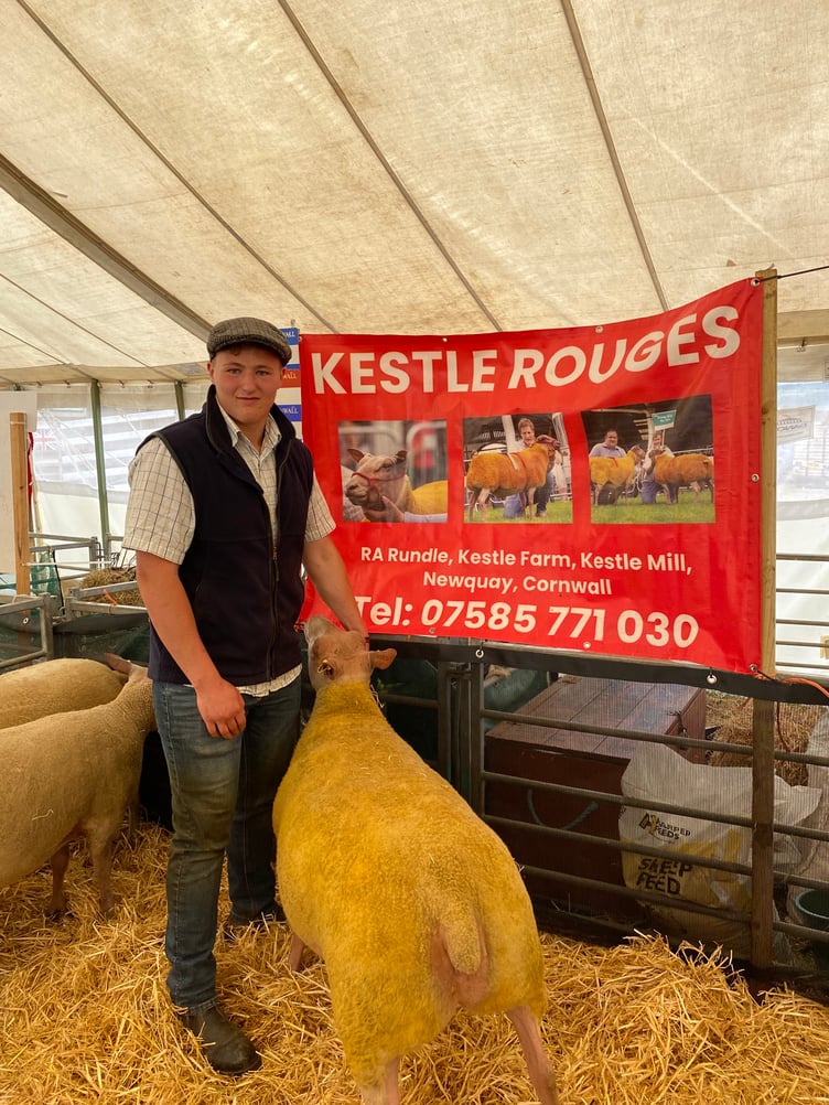 Richard Rundle from Newquay pictured here with his special ewe who won female champion with his Kestle Rouge. The Rundle family also won Reserve Breed Champion and Reserve Champion Female. Richard explained: “We are delighted, we have had a very good season.” The Rundle family had a string of wins in other areas of the show with their South Devon Cattle and Hampshire Down sheep.