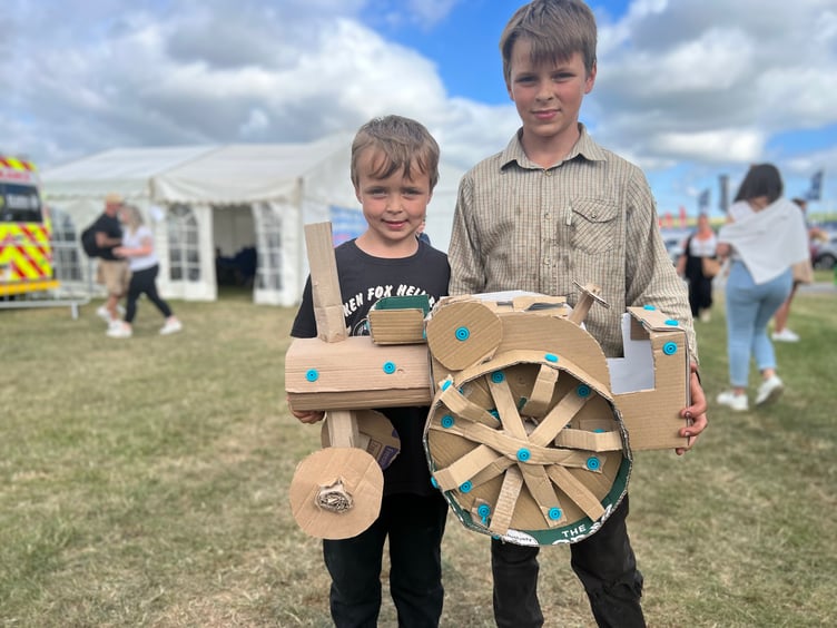 Thomas and Benjamin with their cardboard traction engine