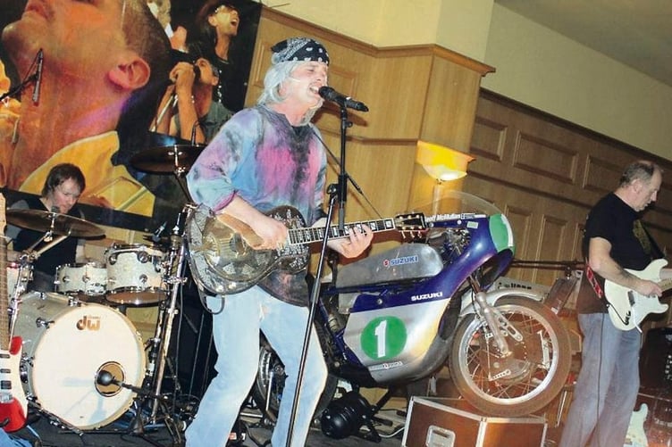 RJ Woolsey performing on stage - (Belfast Telegraph)