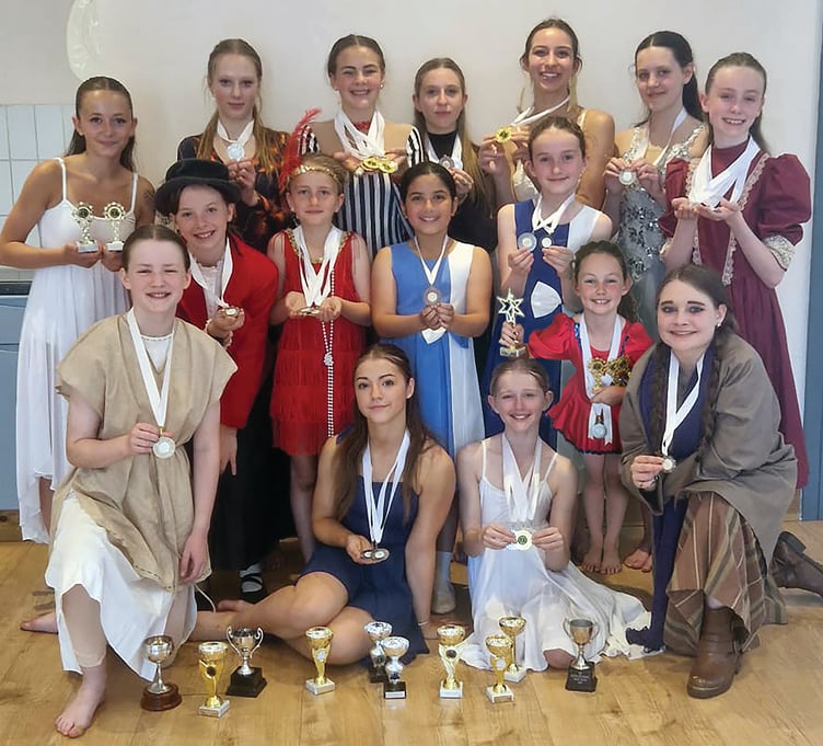 The Haslemere Performing Arts Festival team with their impressive haul of medals