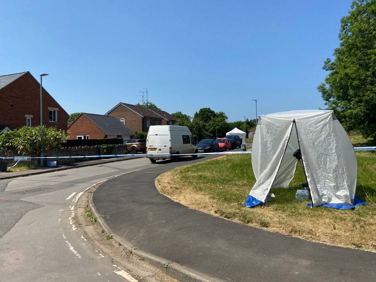 Forensic investigation tents were setup at either end of the street