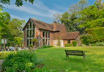 Rural Elstead home for sale has "enchanting" woodland garden 