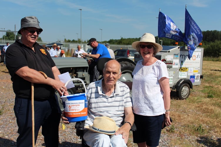 Keith Stanlake of Crediton who has MND with his wife Elaine who had gone to support Peter on his tractor behind them. SR 8031