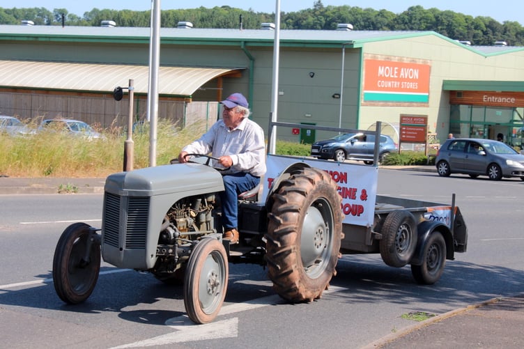 Mid Devon Tractor Engine and Machinery Group chairman John Moore leaving Mole Avon to drive through the High Street. SR 8059