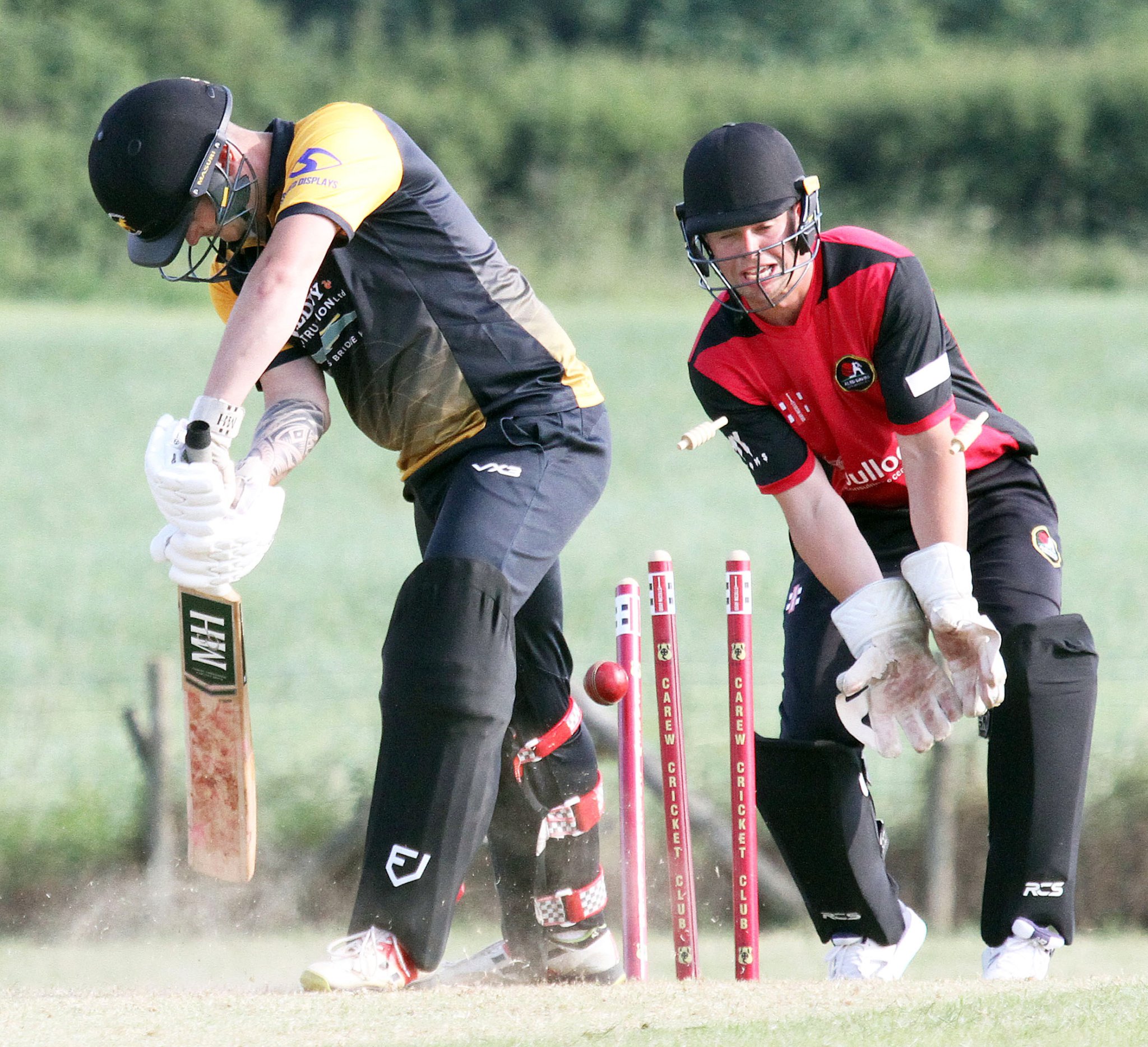 Chaos at the wicket for Tom Cole at the hands of Carew bowler Sam Harts