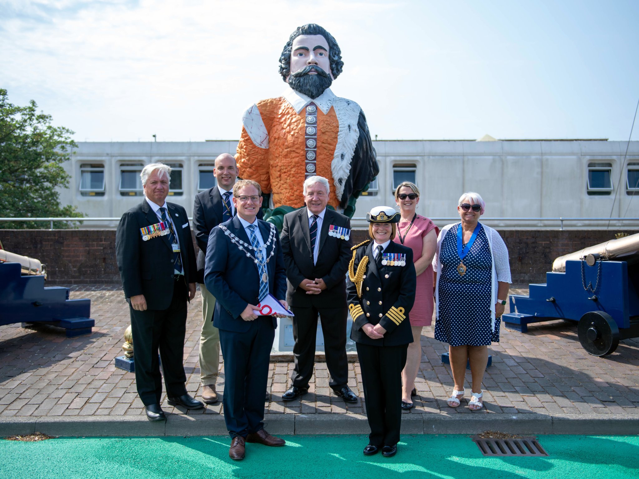 ABOVE: Deputy Lord Lieutenant Rear Admiral Mike Wood CBE JP DL, Deputy Lord Lieutenant for Cornwall, Captain of HMS Raleigh, Captain Jane Roe ADC Roya Navy, and Mayor of Torpoint, Cllr Gary Davis at the relay