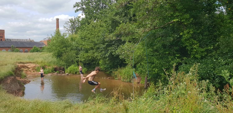 Youngsters continued river jumping in Fox's Field, Wellington, after their friend had been taken away in an ambulance.