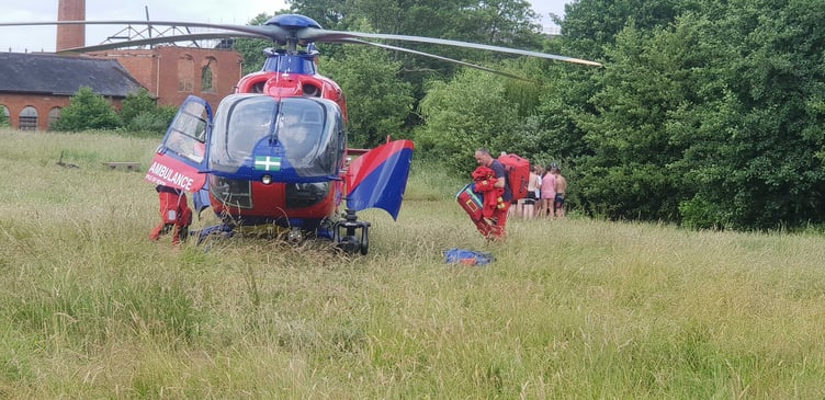 Air ambulance paramedics clear up after the emergency in Fox's Field, Wellington.