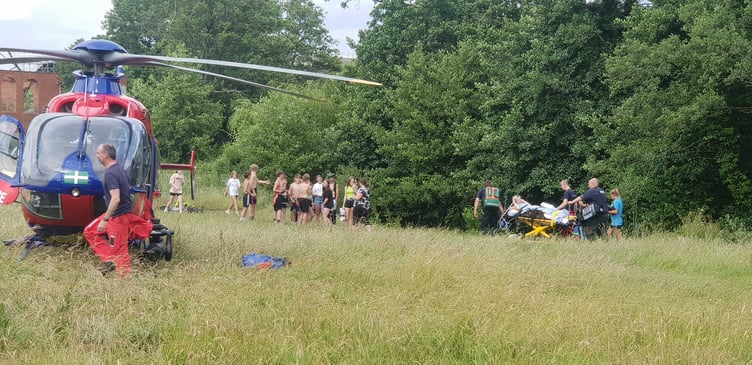 The injured youngster is stretchered from the river bank in Fox's Field, Wellington.
