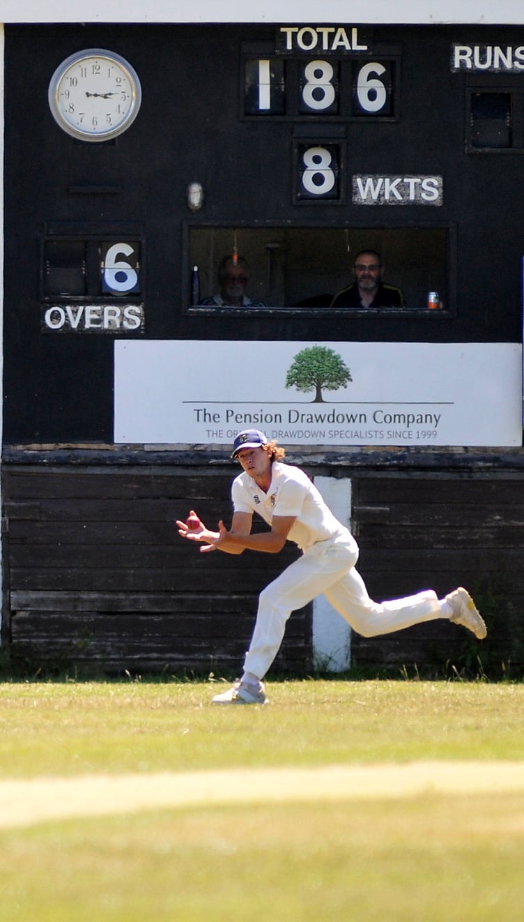 MDA240623C_SP004 Photo: Steve Pope
Devon Cricket League B Division. Chudleigh versus Bridestowe. Harrison May collects the ball belted skyward by Bridestowe's skipper Daniel Forgarty off Kim Singh's bowling