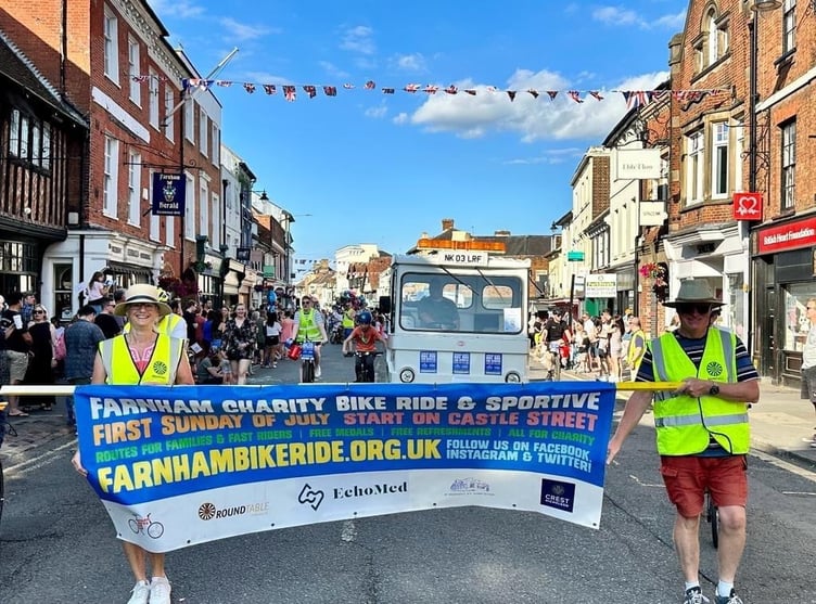Farnham Round Table promote the bike ride in the Farnham Carnival parade last Saturday
